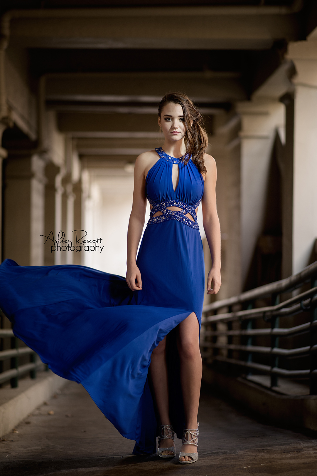 fierce high school senior girl in blue prom dress 