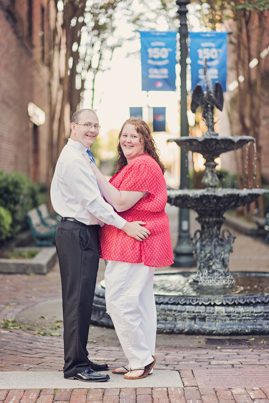 couple in front of fountain in new bern nc