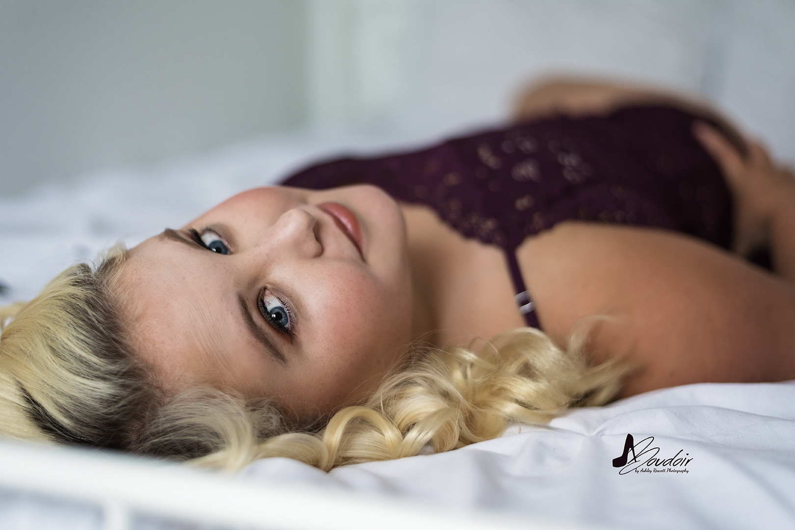 blonde bombshell on bed