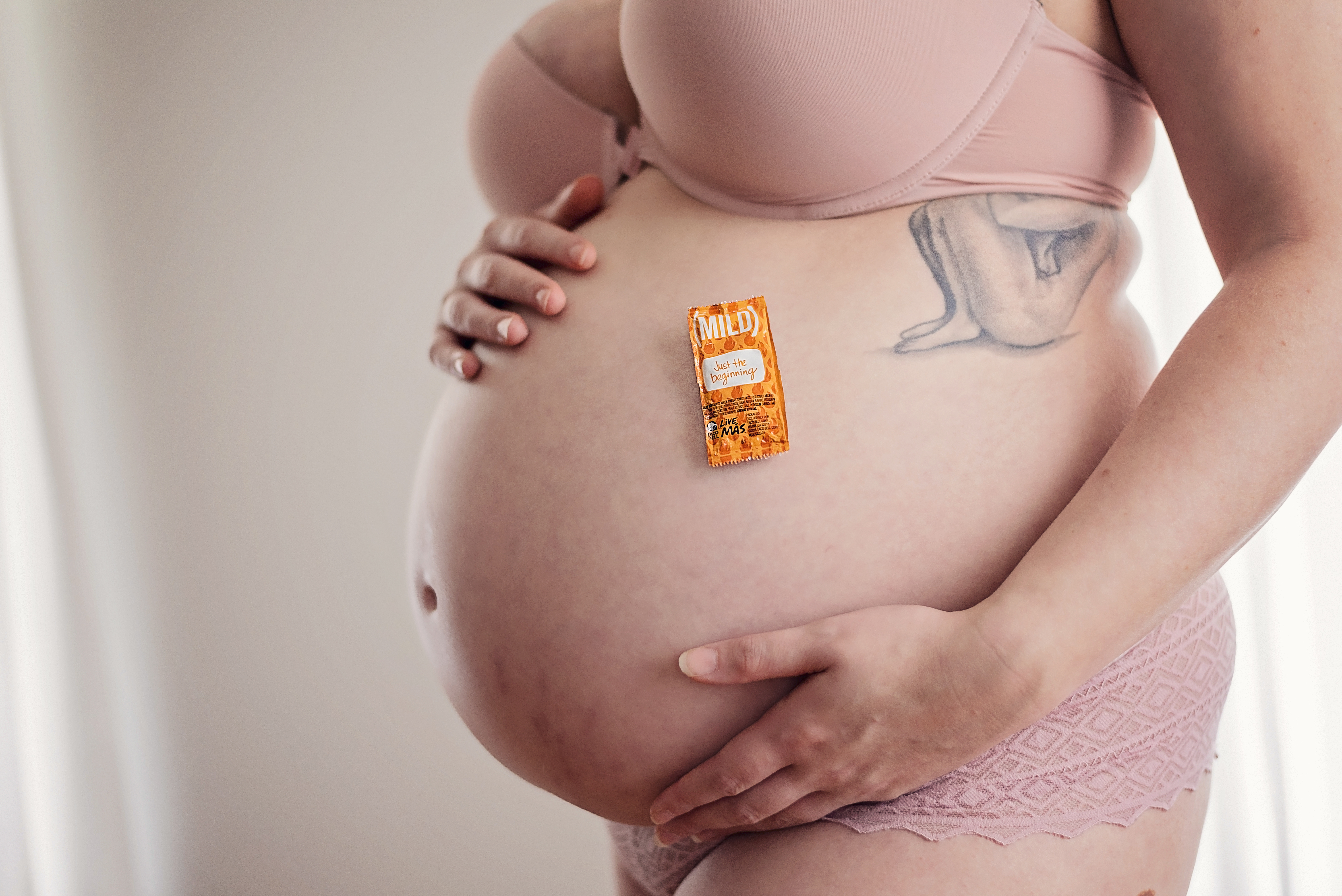 baby belly with taco bell sauce packet