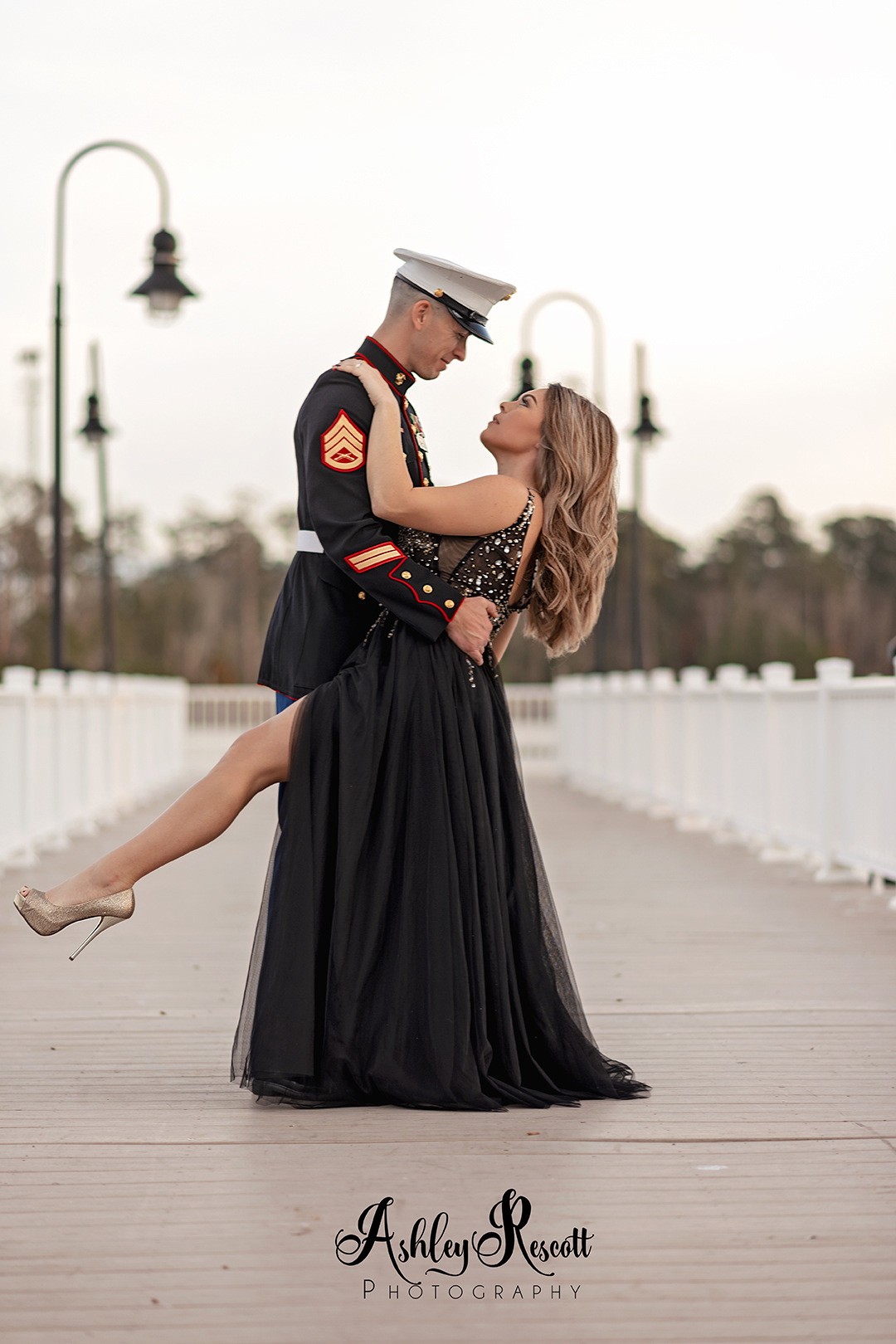 Marine dancing with his wife on pier