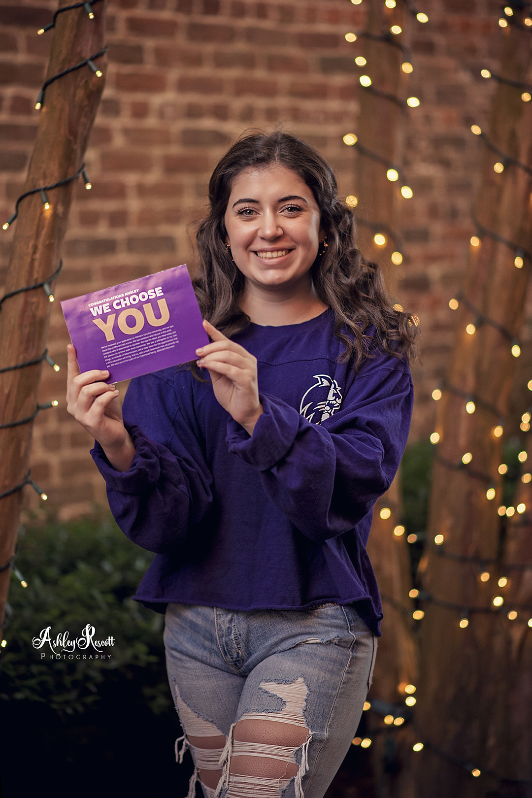 teen girl with college acceptance letter