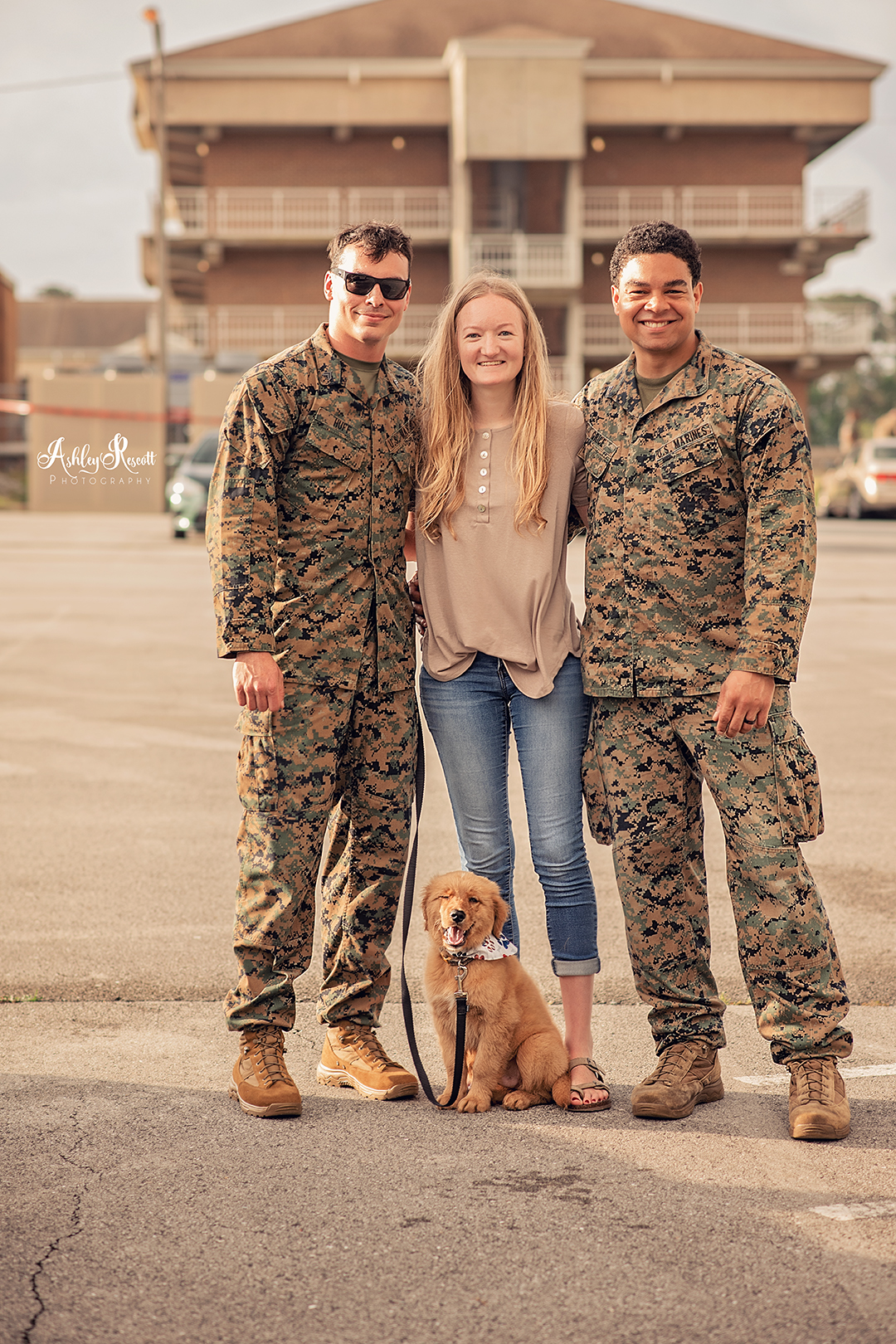 marine, battle buddy, wife pose with puppy