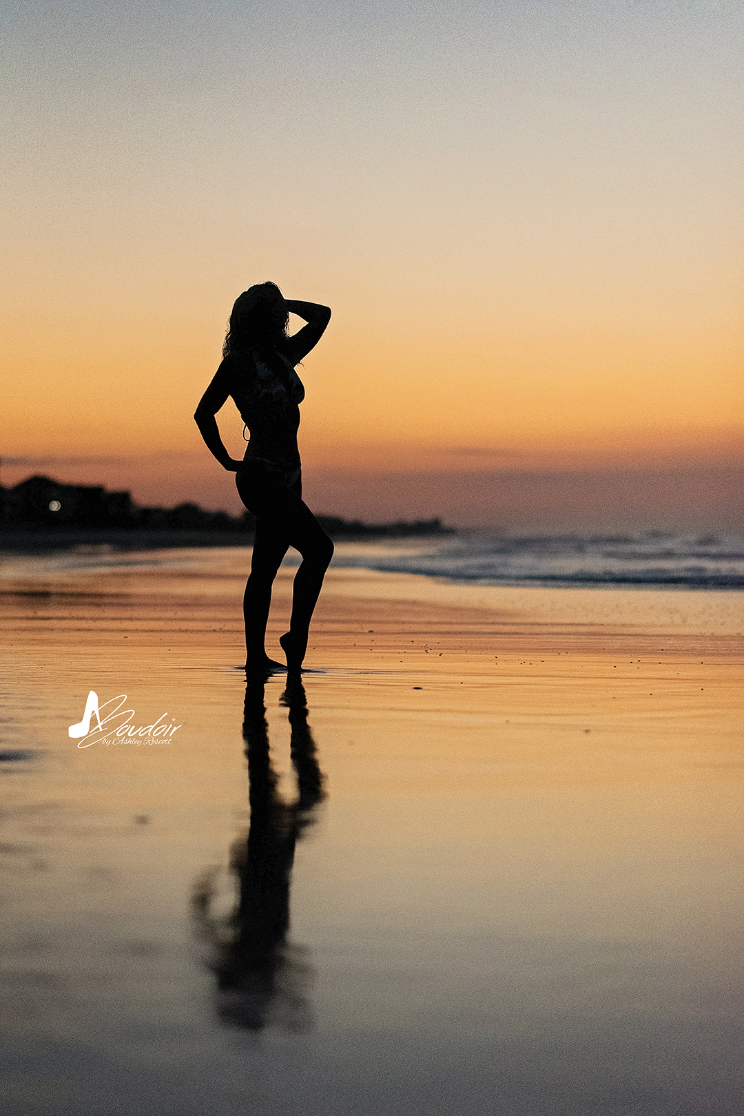 silhouette of woman standing on beach