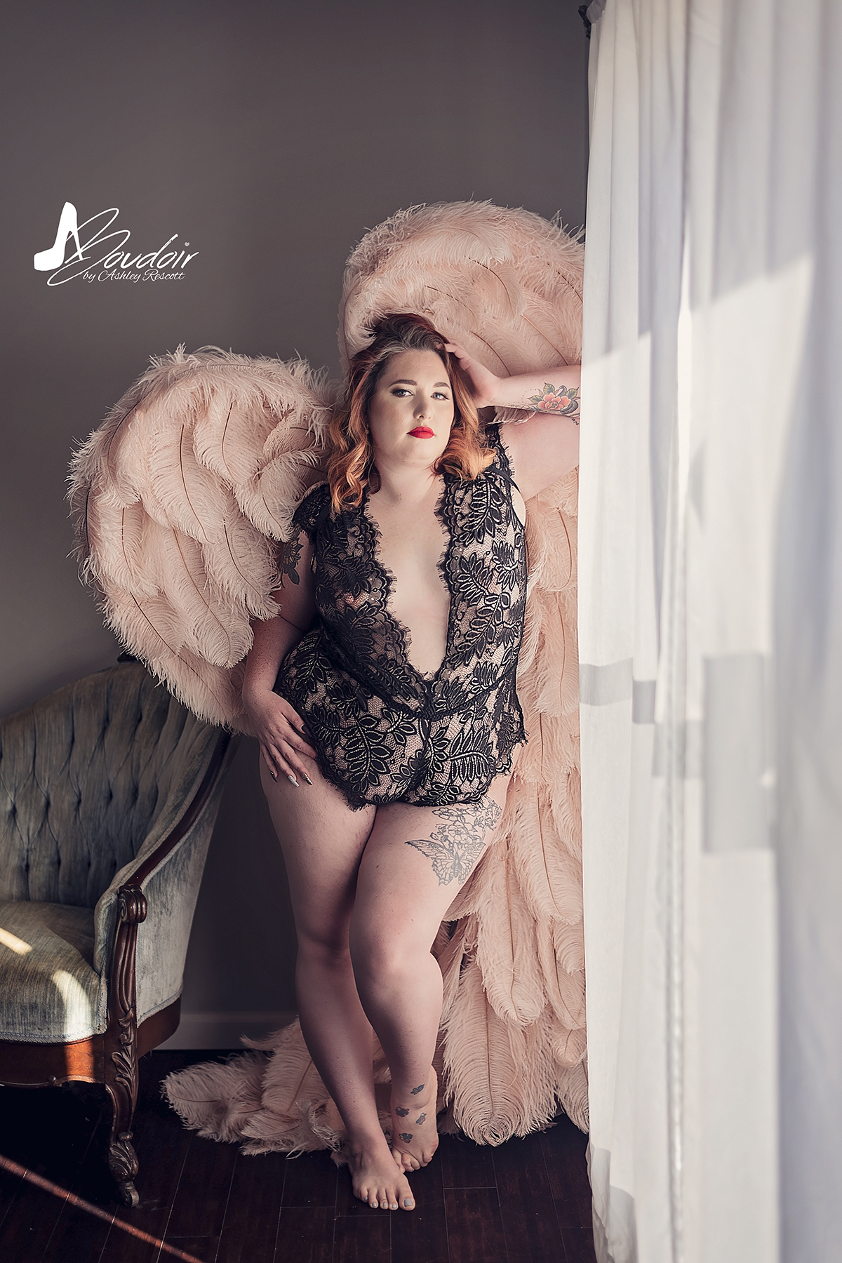 curvy model in lingerie and angel wings